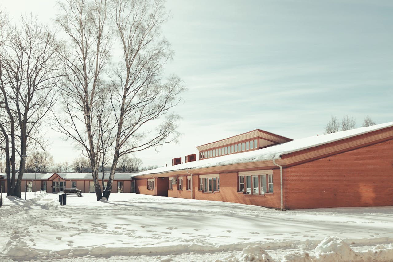 gallery-5 Winter landscape of a snow-covered building and trees in Jönköping, Sweden.